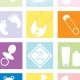 A colorful photo of baby items such as a pacifier, diaper pin and bassinet.