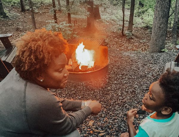 Mom and toddler at a camp site.