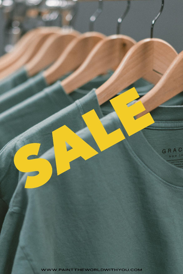 Nordstrom anniversary sale with green shirts on a hanger.
